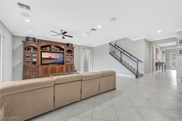 living room with ceiling fan, light tile flooring, and ornamental molding