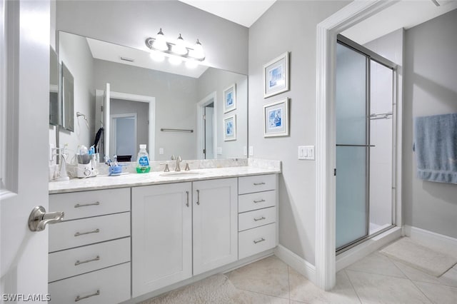 bathroom with tile flooring, an enclosed shower, and oversized vanity