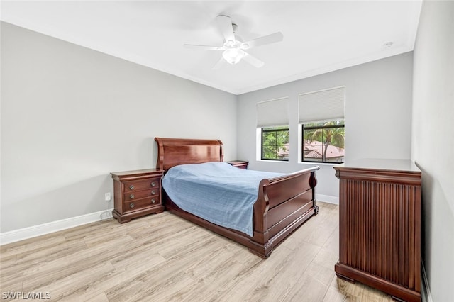 bedroom with ceiling fan and light hardwood / wood-style flooring