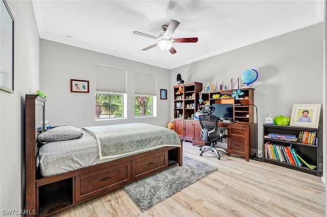 bedroom with ceiling fan, light hardwood / wood-style flooring, and crown molding