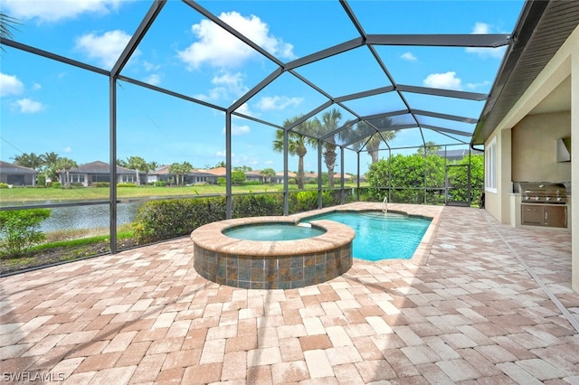 view of swimming pool featuring a water view, an outdoor kitchen, a lanai, and a patio