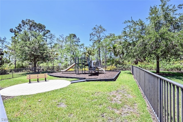 surrounding community with a playground and a yard