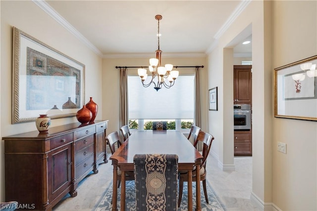 dining room featuring crown molding and a notable chandelier