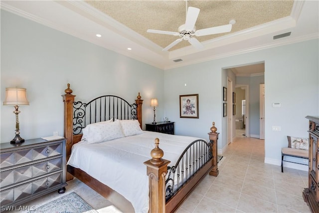 bedroom with crown molding, ceiling fan, a raised ceiling, and light tile patterned flooring
