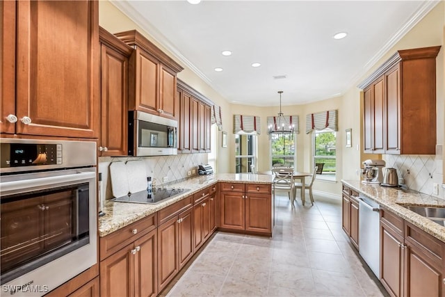 kitchen featuring ornamental molding, appliances with stainless steel finishes, kitchen peninsula, pendant lighting, and light stone countertops
