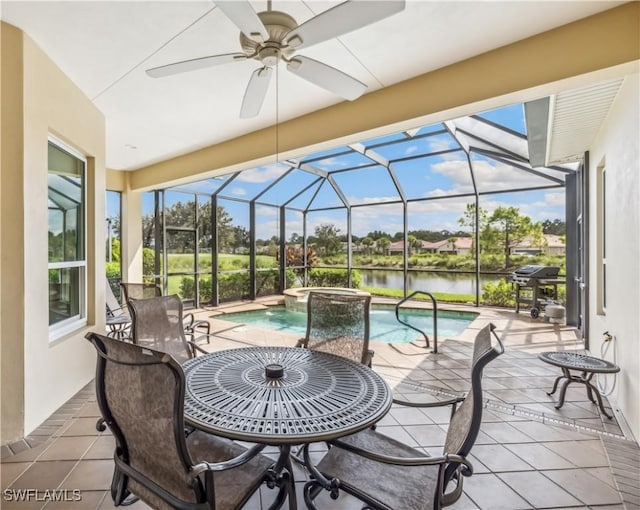 view of patio with a water view, a swimming pool with hot tub, and glass enclosure