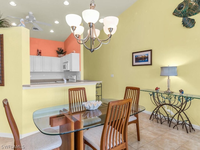 dining space with ceiling fan with notable chandelier and light tile floors