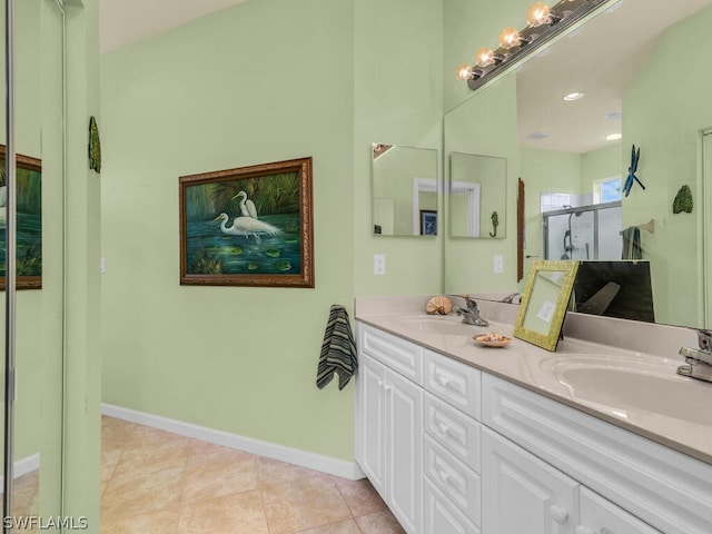 bathroom featuring double sink vanity and tile flooring