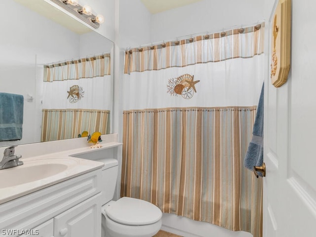 bathroom featuring toilet and vanity