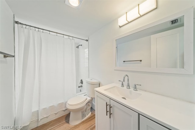 full bathroom featuring wood-type flooring, vanity, toilet, and shower / bath combination with curtain