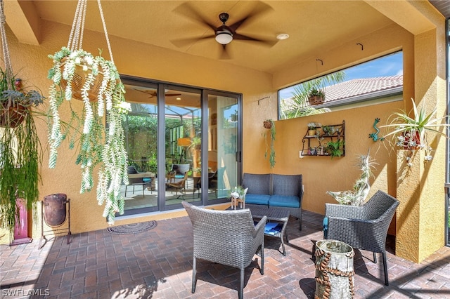 view of patio with ceiling fan and an outdoor hangout area