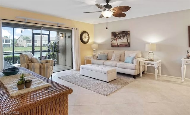 tiled living room with ceiling fan