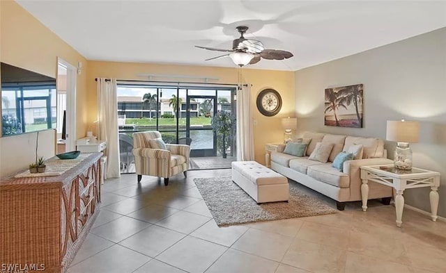 tiled living room with ceiling fan