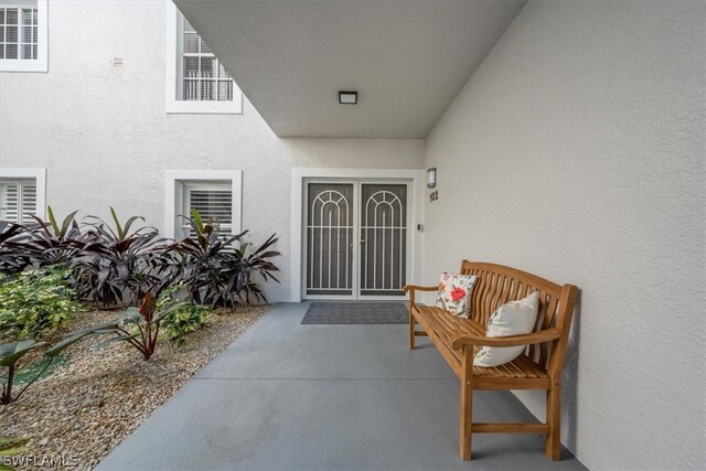 doorway to property featuring a patio