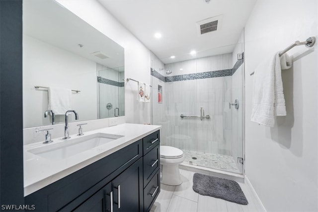 bathroom with tile patterned flooring, vanity, toilet, and an enclosed shower