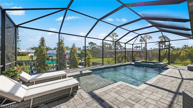 view of swimming pool with a patio area, an in ground hot tub, and a lanai