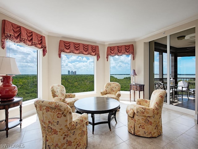 sitting room featuring light tile patterned flooring and ornamental molding