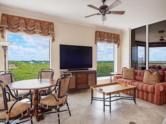 living room featuring ceiling fan and crown molding