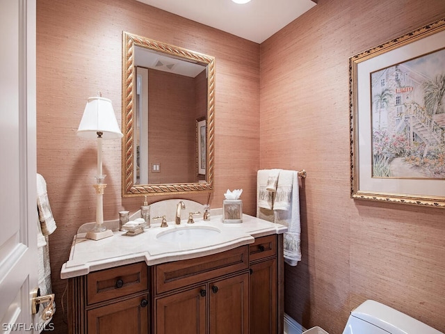 bathroom with vanity and toilet