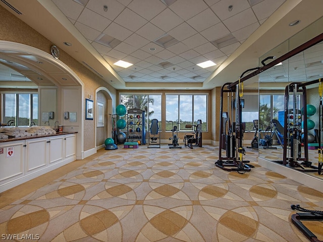 workout area featuring a drop ceiling