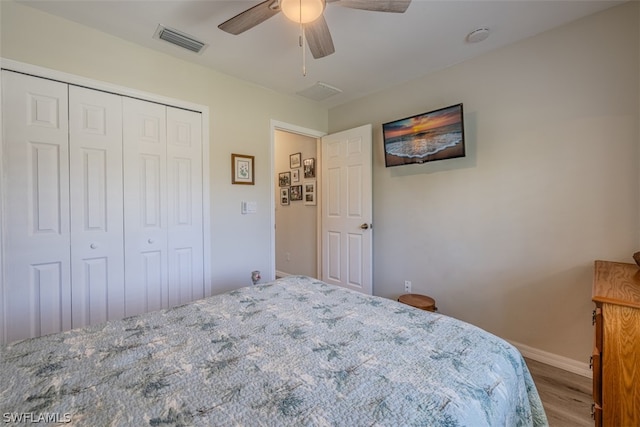 unfurnished bedroom featuring a closet, ceiling fan, and dark hardwood / wood-style flooring