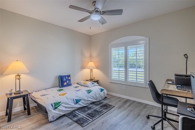 bedroom featuring ceiling fan and light hardwood / wood-style flooring