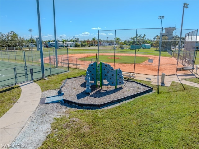 view of property's community featuring a playground and a yard