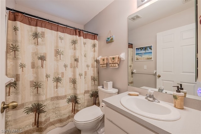 bathroom with oversized vanity and toilet