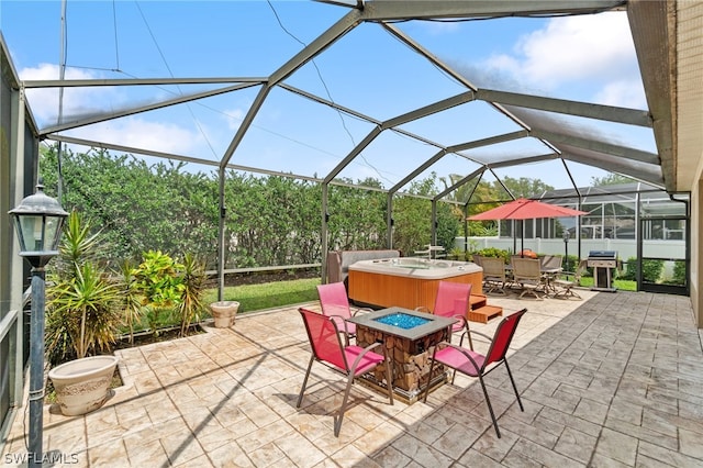 view of patio featuring area for grilling, a lanai, and a fire pit