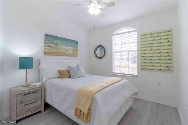 bedroom with ceiling fan and light hardwood / wood-style flooring