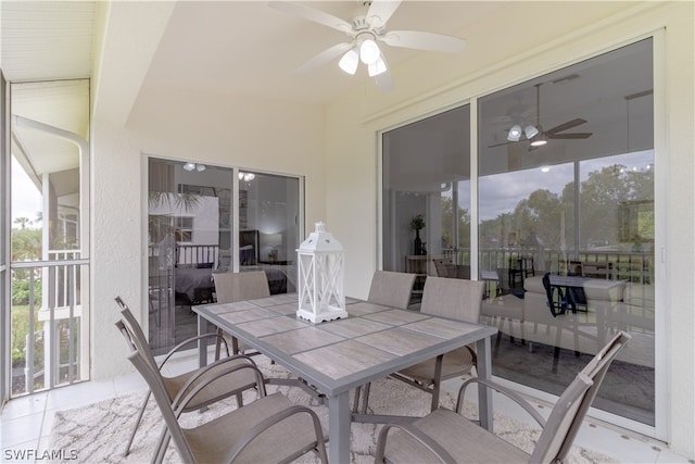 sunroom with ceiling fan and a wealth of natural light