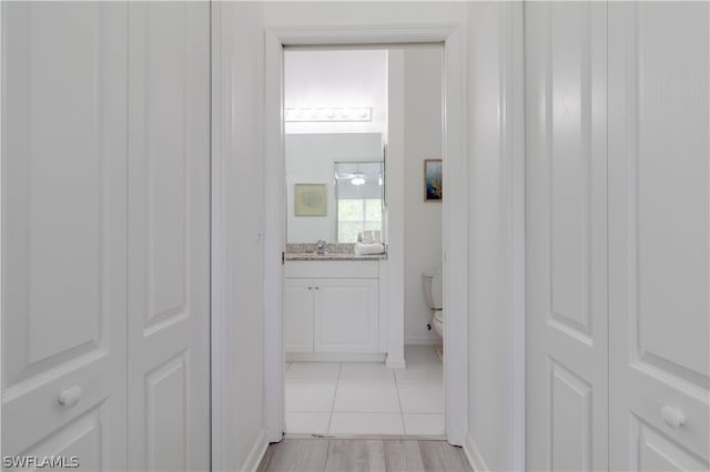 hallway with light tile flooring