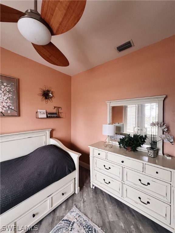 bedroom featuring dark hardwood / wood-style floors and ceiling fan