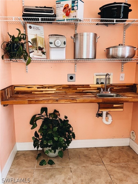 interior space with tile flooring and sink