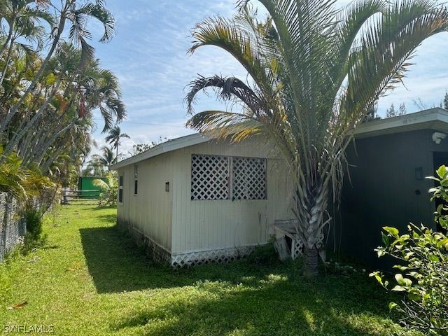 view of shed / structure featuring a lawn