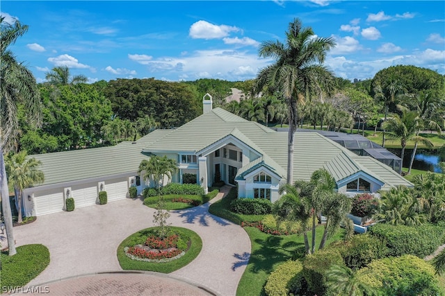 view of front facade with a lanai and a garage