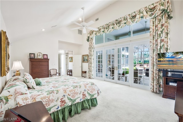 carpeted bedroom with access to exterior, ceiling fan, french doors, and high vaulted ceiling