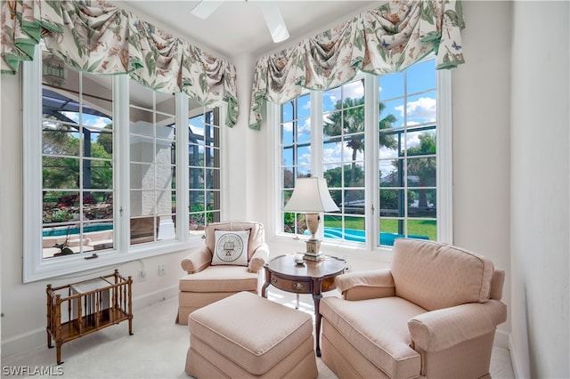 interior space featuring ceiling fan and a healthy amount of sunlight