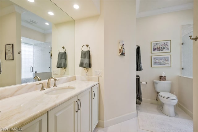 bathroom with toilet, vanity, tile patterned floors, and walk in shower