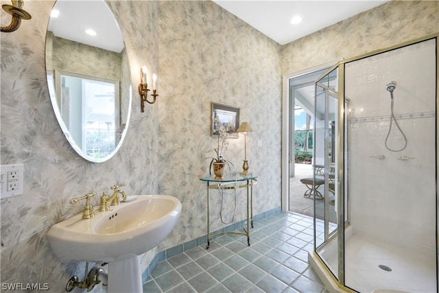 bathroom with tile patterned floors, plenty of natural light, and an enclosed shower