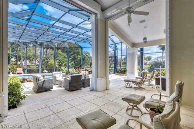 unfurnished sunroom with vaulted ceiling and ceiling fan