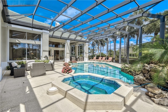 view of swimming pool with an in ground hot tub, an outdoor hangout area, and a patio area