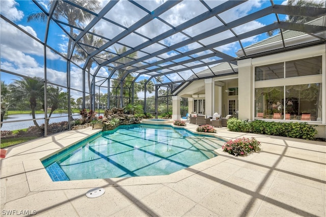 view of pool with an in ground hot tub, a lanai, an outdoor living space, a water view, and a patio