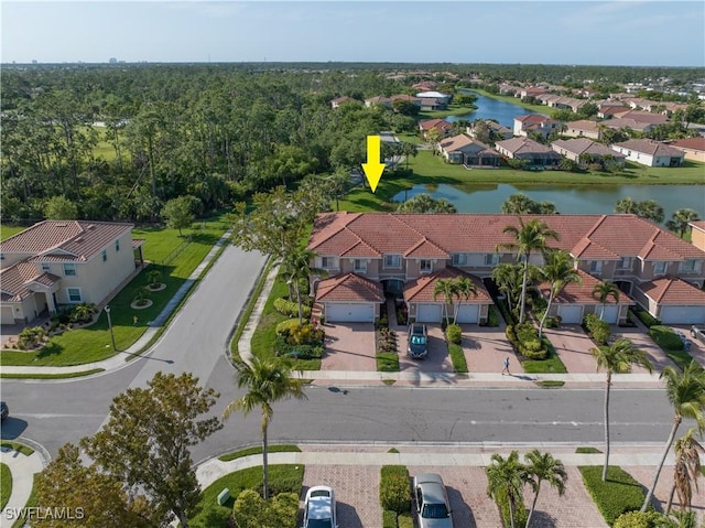 birds eye view of property with a water view