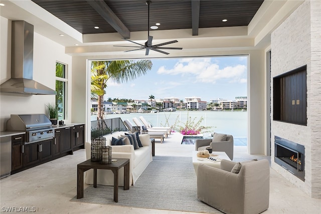 view of patio featuring area for grilling, a grill, an outdoor living space with a fireplace, and ceiling fan