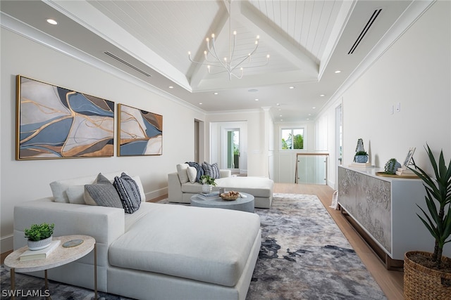 living area featuring crown molding, recessed lighting, visible vents, wood finished floors, and a chandelier