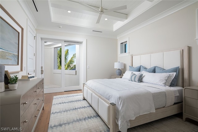 bedroom with access to outside, beam ceiling, ornamental molding, light wood-type flooring, and coffered ceiling