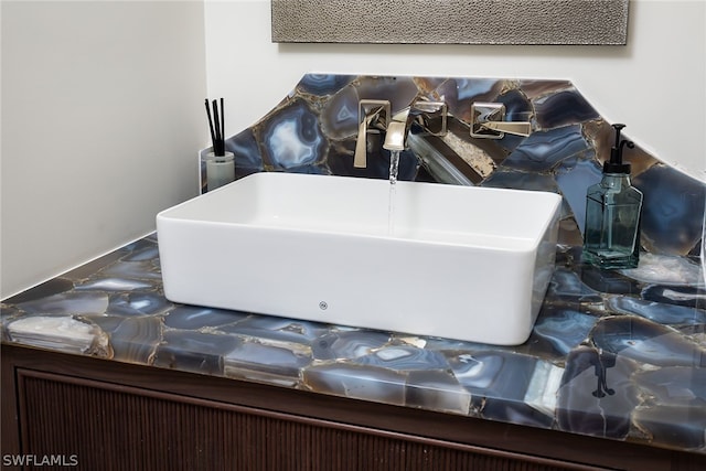 interior details with a freestanding tub and a sink