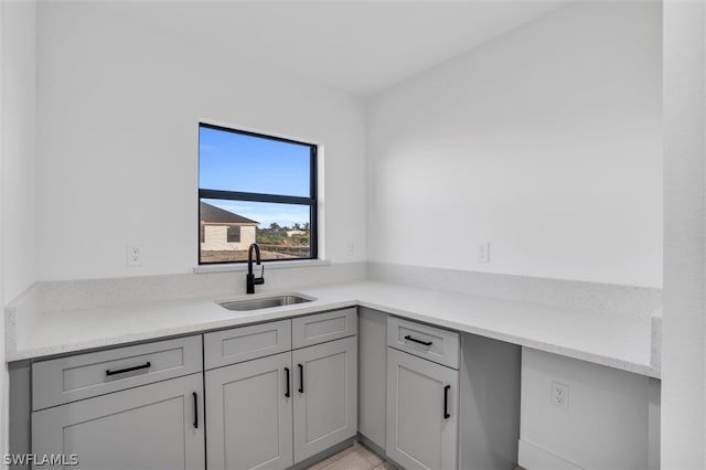 kitchen with gray cabinets and sink