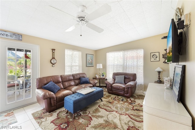 living room with ceiling fan and light tile floors